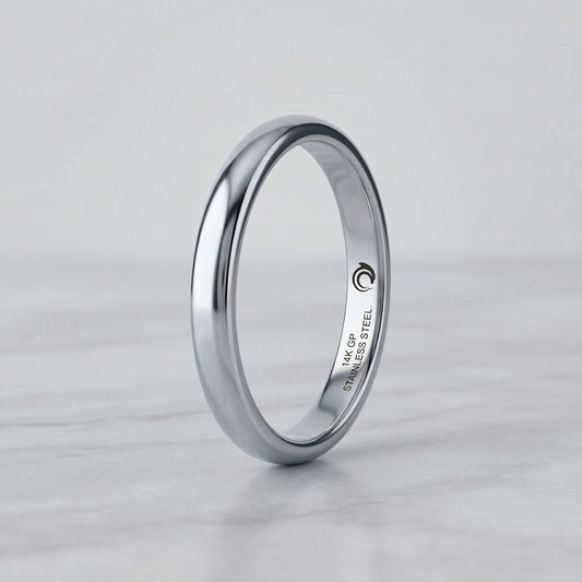Silver ring with engraved text with the AskDolphin logo on a light gray background